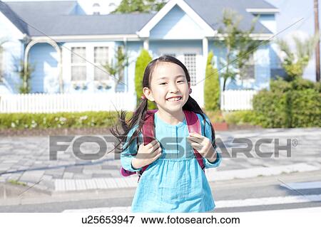 Stock Photo - Portrait of schoolgirl, Japan. Fotosearch