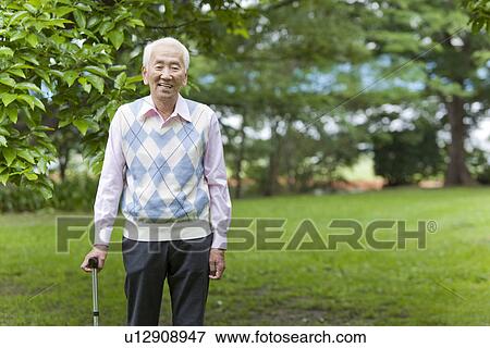 Portrait of senior man with cane, Tokyo Prefecture, Honshu, Japan View Large Photo Image Stock Photo - Portrait of senior man with cane, Tokyo Prefecture, Honshu, Japan. Fotosearch