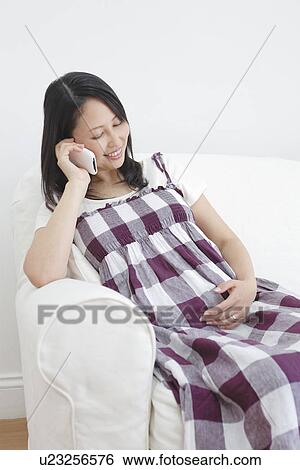 Pregnant Woman on Phone View Large Photo Image Stock Photograph - Pregnant Woman on Phone. Fotosearch