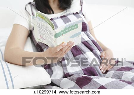 Pregnant Woman Reading Picture Book View Large Photo Image Picture - Pregnant Woman Reading Picture Book. Fotosearch