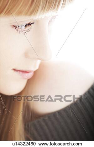Stock Image - Profile of young woman. Fotosearch