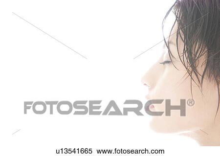 Stock Photography - Profile of young woman with eyes closed. Fotosearch
