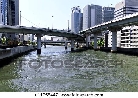 Stock Photo - River and highway, Osaka City, Osaka Prefecture, Honshu, Japan. Fotosearch