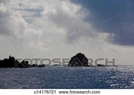 Stock Image - Rocks in Sea. Fotosearch