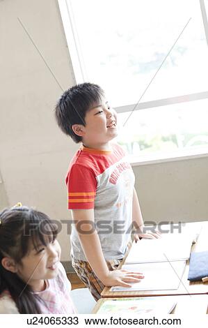 Stock Image - Schoolboy Standing and Talking. Fotosearch