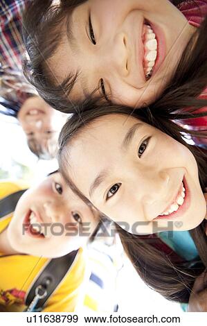 Stock Photo - Schoolchildren in Huddle. Fotosearch