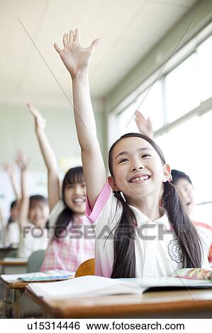 Schoolchildren Raising Hands in Classroom View Large Photo Image Stock Photograph - Schoolchildren Raising Hands in Classroom. Fotosearch