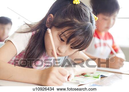 Schoolgirl Writing View Large Photo Image Picture - Schoolgirl Writing. Fotosearch