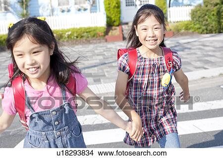 Schoolgirls crossing street, Japan View Large Photo Image Picture - Schoolgirls crossing street, Japan. Fotosearch
