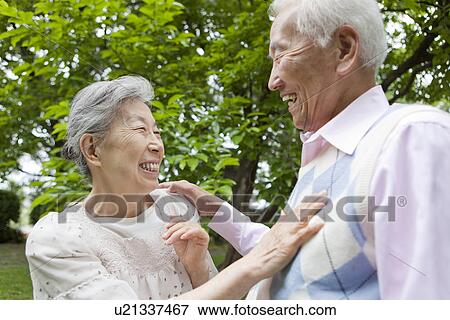 Senior couple standing face to face, Tokyo Prefecture, Honshu, Japan View Large Photo Image Stock Photo - Senior couple standing face to face, Tokyo Prefecture, Honshu, Japan. Fotosearch