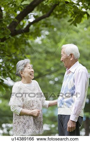 Senior couple standing face to face, Tokyo Prefecture, Honshu, Japan View Large Photo Image Stock Photograph - Senior couple standing face to face, Tokyo Prefecture, Honshu, Japan. Fotosearch