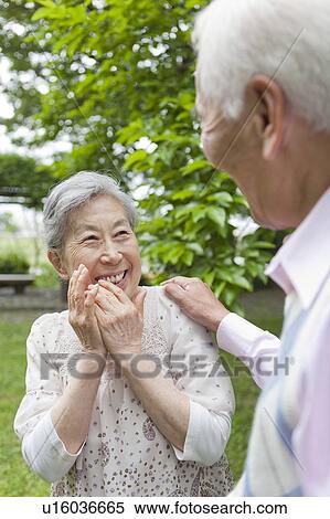 Senior couple standing face to face, Tokyo Prefecture, Honshu, Japan View Large Photo Image Stock Photography - Senior couple standing face to face, Tokyo Prefecture, Honshu, Japan. Fotosearch