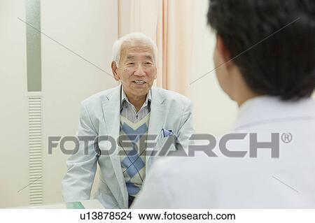 Senior patient talking to doctor, Kanagawa Prefecture, Honshu, Japan View Large Photo Image Picture - Senior patient talking to doctor, Kanagawa Prefecture, Honshu, Japan. Fotosearch