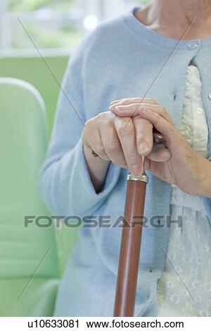 Senior woman holding a walking cane, Kanagawa Prefecture, Honshu, Japan View Large Photo Image Stock Image - Senior woman holding a walking cane, Kanagawa Prefecture, Honshu, Japan. Fotosearch