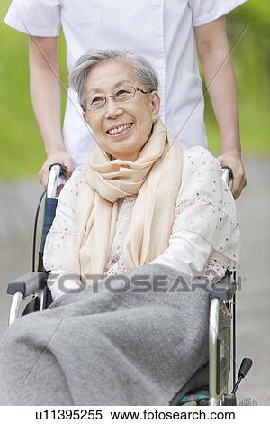 Senior Woman in Wheelchair View Large Photo Image Stock Photography - Senior Woman in Wheelchair. Fotosearch