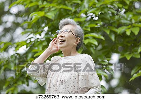 Senior Woman Listening to Nature View Large Photo Image Stock Image - Senior Woman Listening to Nature. Fotosearch