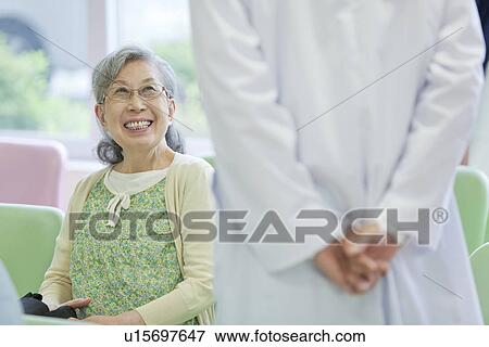 Senior Woman Talking to Doctor View Large Photo Image Stock Photo - Senior Woman Talking to Doctor. Fotosearch
