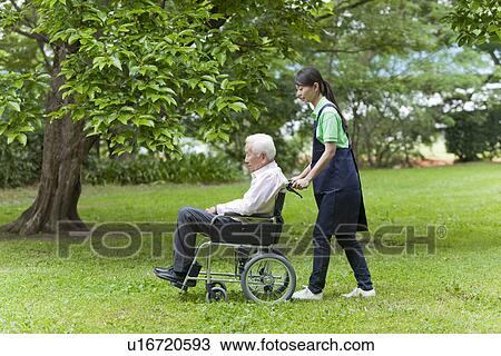 Social Worker with Senior Man on Wheelchair View Large Photo Image Stock Image - Social Worker with Senior Man on Wheelchair. Fotosearch