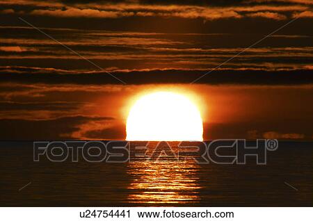 Stock Image - Sunrise Over Horizon. Fotosearch