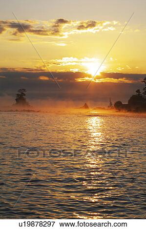 Stock Photo - Sunrise Over Sea. Fotosearch