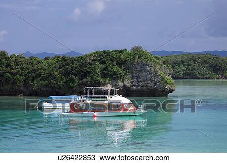 Stock Image - Tourboat Moored Near Coast. Fotosearch