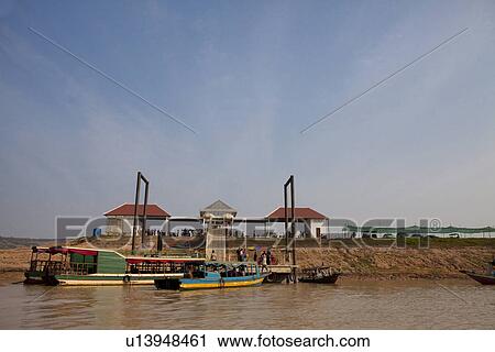 Stock Image - Tourboats at Tonle Sap. Fotosearch