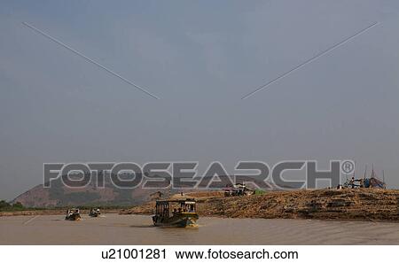 Stock Image - Tourboats at Tonle Sap. Fotosearch