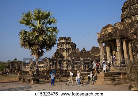 Stock Photograph - Tourists at Angkor Wat. Fotosearch