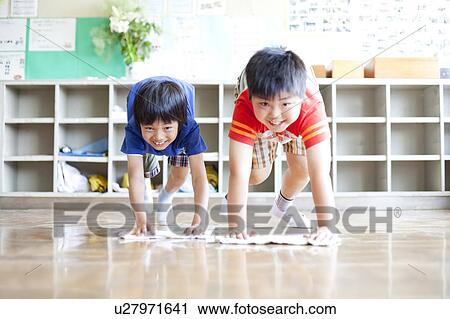 Stock Image - Two Boys Clearning Floor. Fotosearch