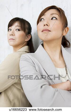 Two Businesswomen Back To Back View Large Photo Image Stock Image - Two Businesswomen Back To Back. Fotosearch