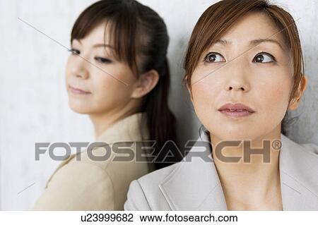 Two Businesswomen Back To Back View Large Photo Image Stock Image - Two Businesswomen Back To Back. Fotosearch