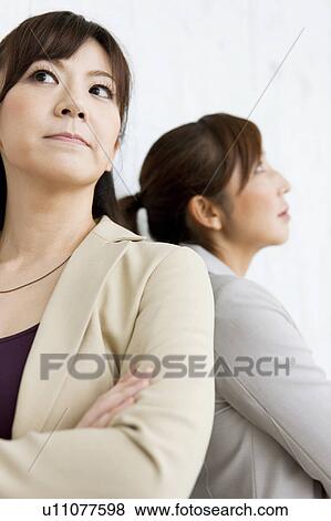Two Businesswomen Back To Back View Large Photo Image Stock Photo - Two Businesswomen Back To Back. Fotosearch