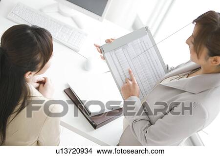 Picture - Two Businesswomen Working. Fotosearch