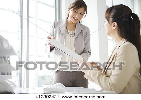 Two Businesswomen Working View Large Photo Image Stock Image - Two Businesswomen Working. Fotosearch