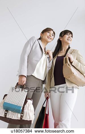 Picture - Two Women With Shopping. Fotosearch