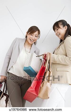 Two Women With Shopping View Large Photo Image Stock Photograph - Two Women With Shopping. Fotosearch
