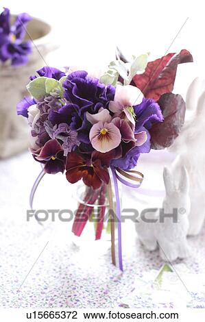Stock Image - Violas in a vase. Fotosearch