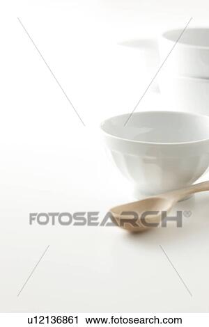 Stock Image - White china and wooden spoon. Fotosearch