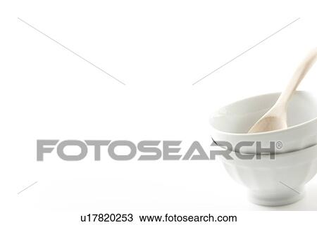 Stock Image - White china and wooden spoon. Fotosearch