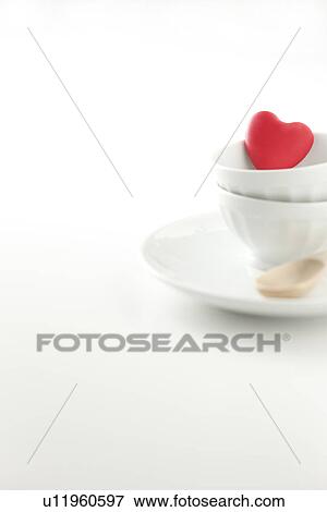 Stock Photo - White china, wooden spoon and heart. Fotosearch