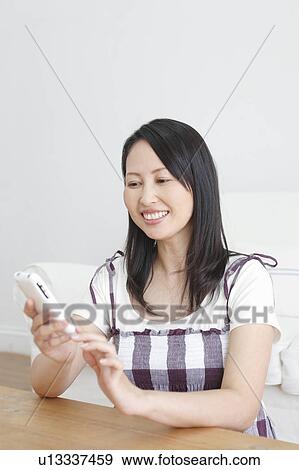 Woman Checking Smart Phone View Large Photo Image Stock Photo - Woman Checking Smart Phone. Fotosearch