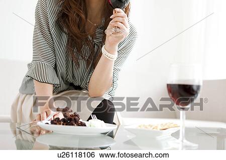 Woman Having Red Wine, Snacks on Table View Large Photo Image Stock Photograph - Woman Having Red Wine, Snacks on Table. Fotosearch