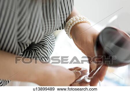 Stock Photo - Woman Having Red Wine. Fotosearch