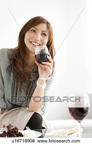 Stock Photo - Woman Having Red Wine. Fotosearch