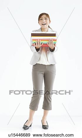 Woman Holding Files View Large Photo Image Stock Photo - Woman Holding Files. Fotosearch