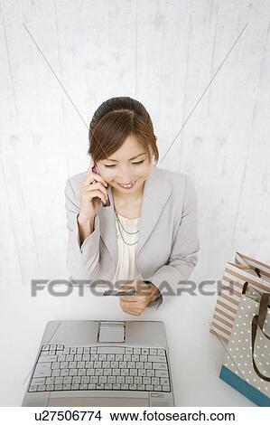 Picture - Woman Online Shopping. Fotosearch