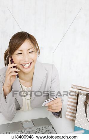 Stock Photo - Woman Online Shopping. Fotosearch