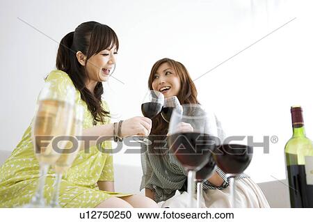 Women Toasting with Red Wine View Large Photo Image Stock Image - Women Toasting with Red Wine. Fotosearch