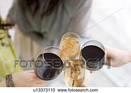 Stock Image - Women Toasting with Wine. Fotosearch