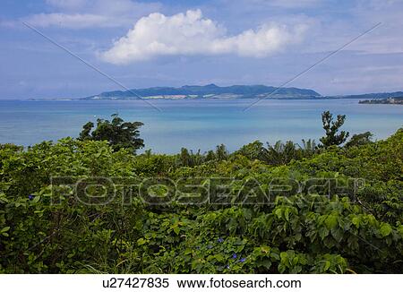 Stock Photography - Yarabu Mountain seen from Ishigaki Nagura Bay. Fotosearch